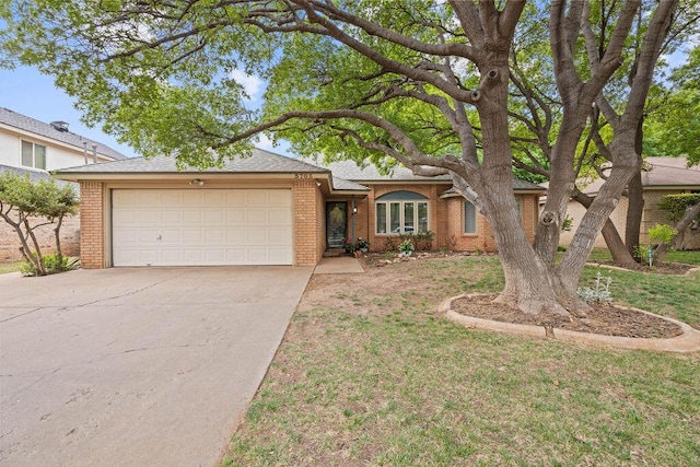 5703 94th St, Lubbock, TX 79424 - ranch-style house with a garage, concrete driveway, and brick siding