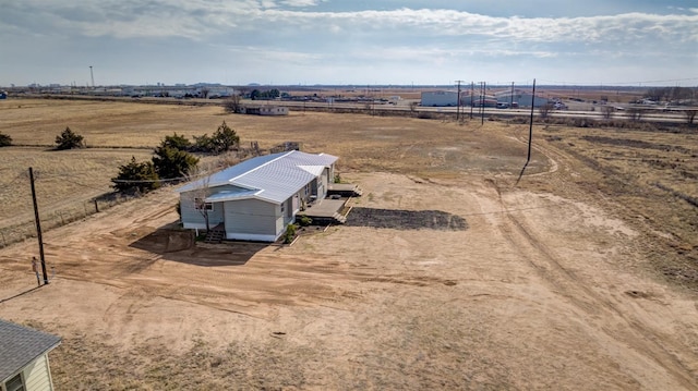 birds eye view of property with a rural view