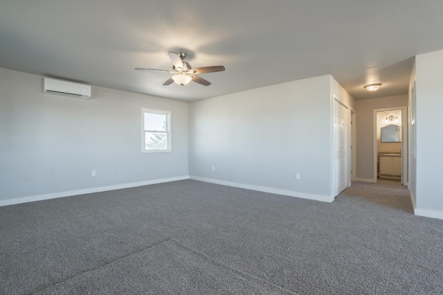 carpeted empty room featuring an AC wall unit and ceiling fan