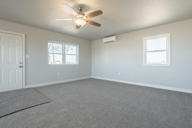 unfurnished room with ceiling fan, a wall mounted air conditioner, and carpet flooring