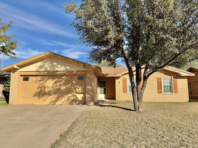 single story home with a garage and a front yard