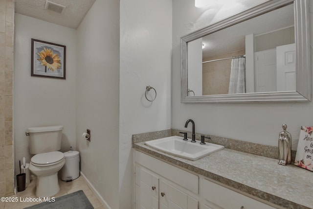 4816 55th St, Lubbock, TX 79414 - full bath featuring toilet, tile patterned flooring, vanity, a textured ceiling, and curtained shower