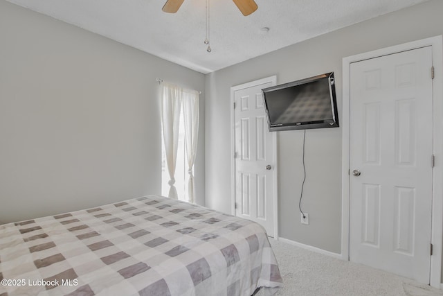 4816 55th St, Lubbock, TX 79414 - bedroom with carpet flooring, a closet, a ceiling fan, and baseboards