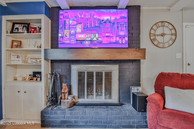 4816 55th St, Lubbock, TX 79414 - detailed view of a fireplace, a textured ceiling, and beam ceiling