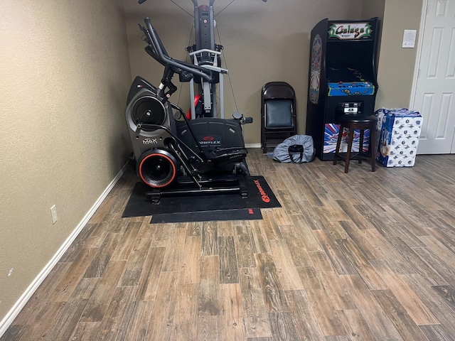 workout room featuring hardwood / wood-style floors