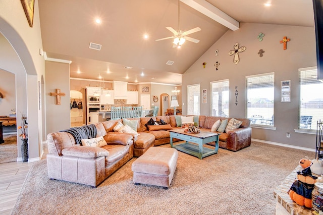 living room featuring beamed ceiling, ceiling fan with notable chandelier, and high vaulted ceiling