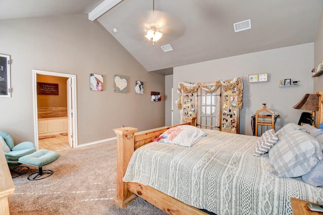 bedroom featuring ensuite bath, high vaulted ceiling, light carpet, ceiling fan, and beam ceiling