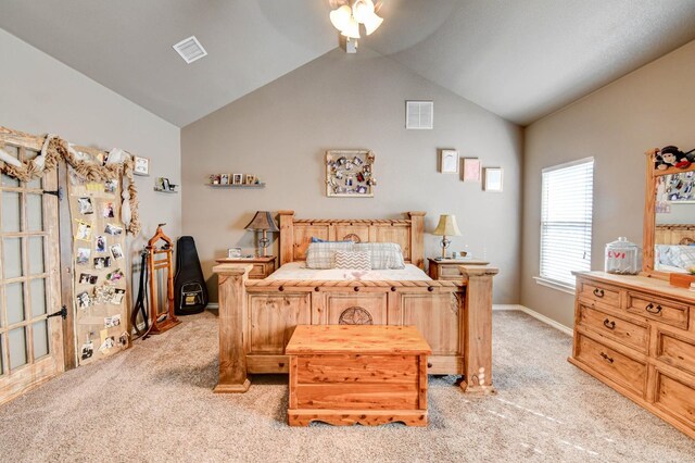 carpeted bedroom with ceiling fan and lofted ceiling