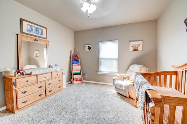 bedroom featuring ceiling fan and light colored carpet