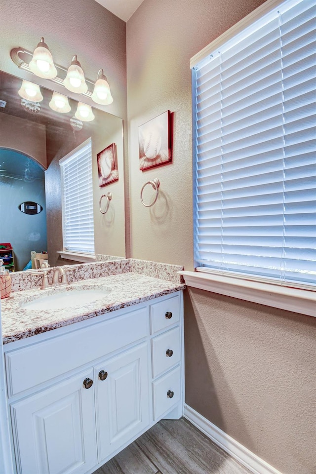 bathroom featuring vanity and hardwood / wood-style floors