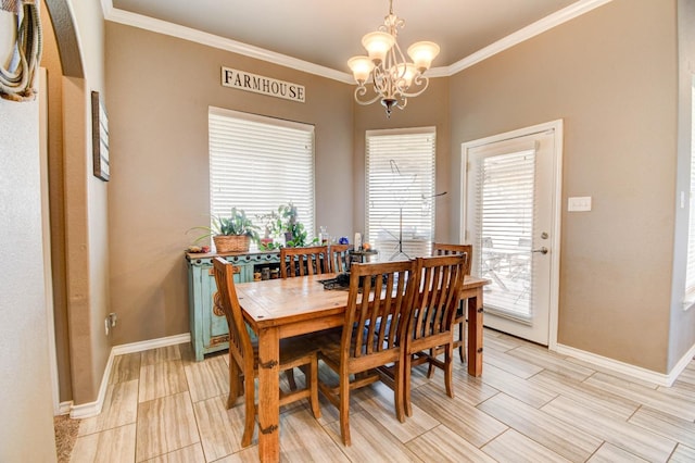 dining room featuring crown molding and an inviting chandelier