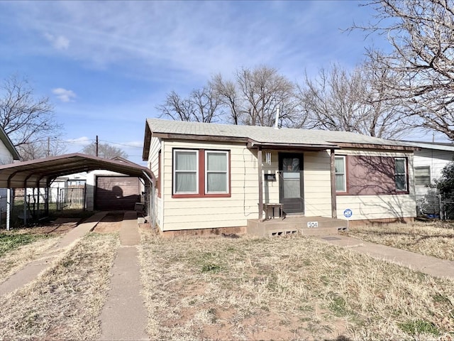 view of front of home featuring a carport