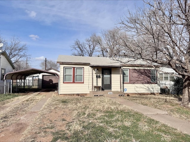 view of front of home with a carport