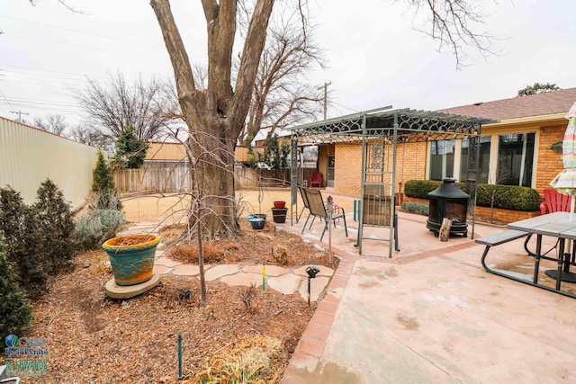exterior space with a fenced backyard and a patio