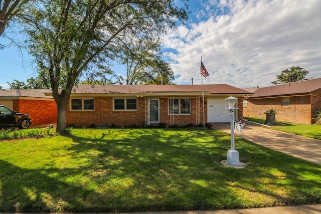 ranch-style house with an attached garage, brick siding, driveway, and a front lawn