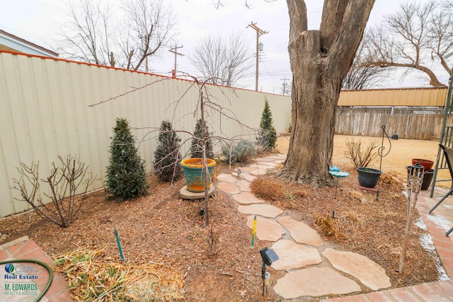 view of yard with a fenced backyard