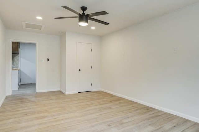 spare room with ceiling fan and light hardwood / wood-style flooring