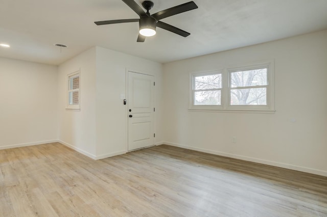 foyer entrance featuring ceiling fan and light wood-type flooring