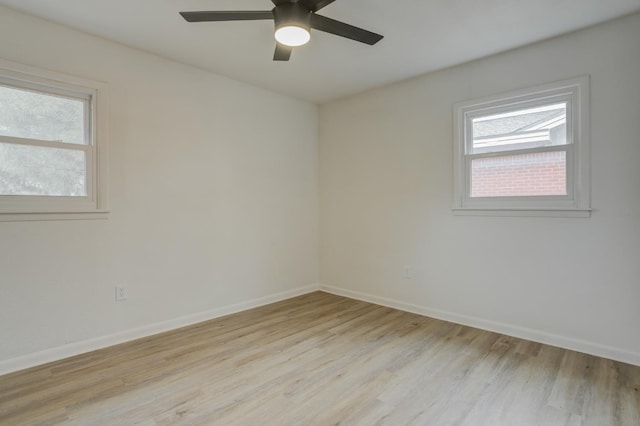 empty room featuring ceiling fan and light hardwood / wood-style flooring