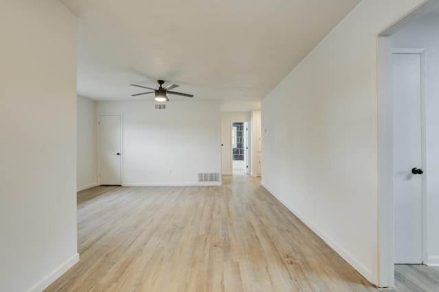 empty room featuring ceiling fan and light hardwood / wood-style floors