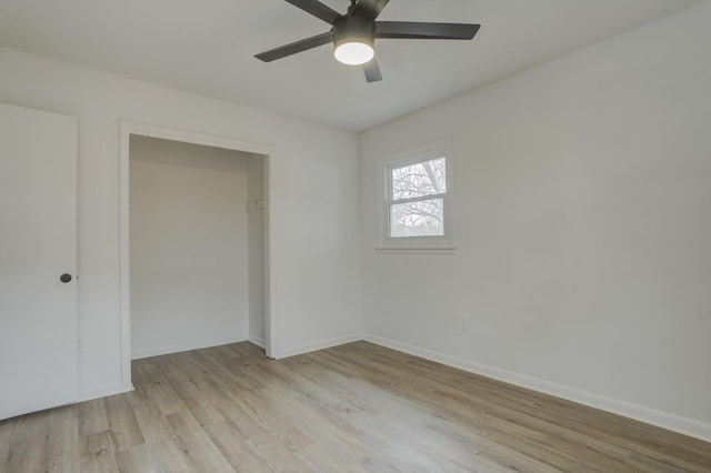 unfurnished room with ceiling fan and light hardwood / wood-style flooring