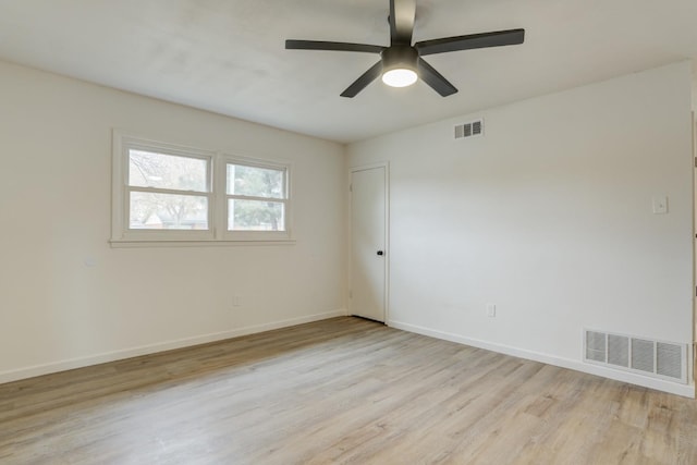 spare room with light hardwood / wood-style flooring and ceiling fan