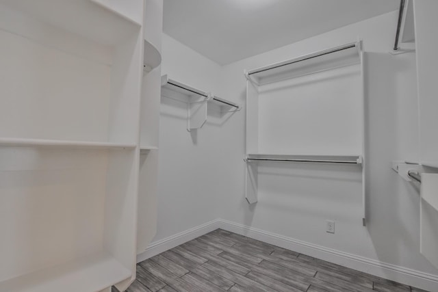 walk in closet featuring light hardwood / wood-style flooring