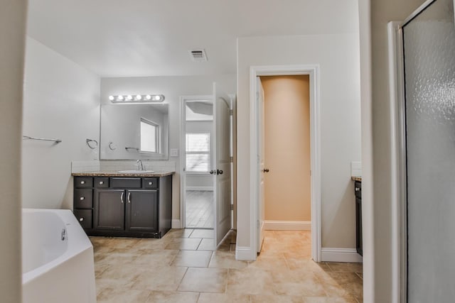 bathroom with vanity, shower with separate bathtub, and tile patterned flooring