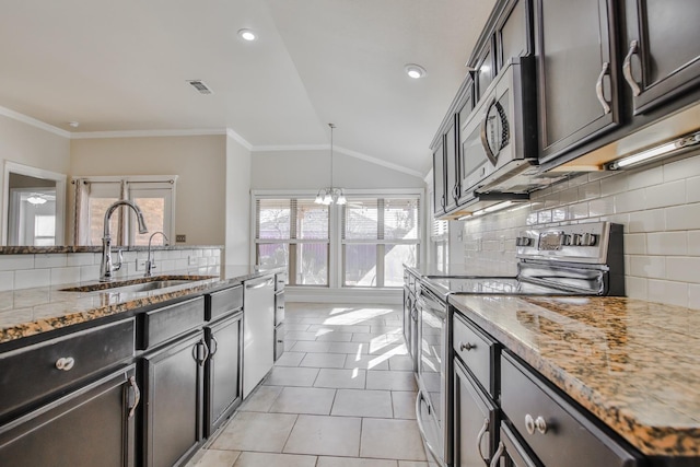 kitchen featuring lofted ceiling, sink, ornamental molding, and appliances with stainless steel finishes