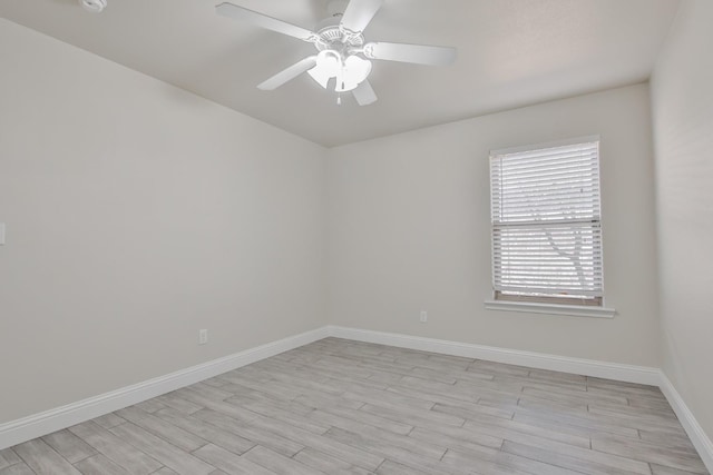 empty room featuring light wood-type flooring and ceiling fan