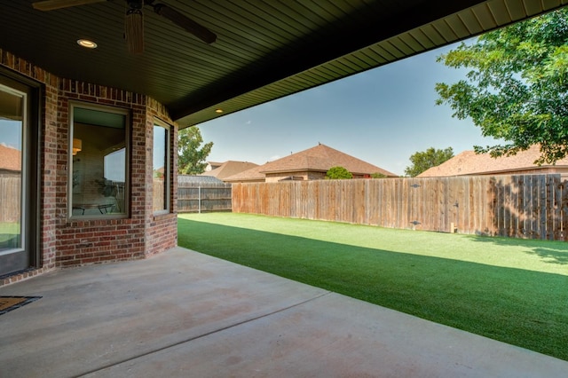 view of yard featuring a patio and ceiling fan