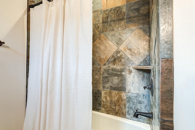 bathroom featuring shower / tub combo with curtain