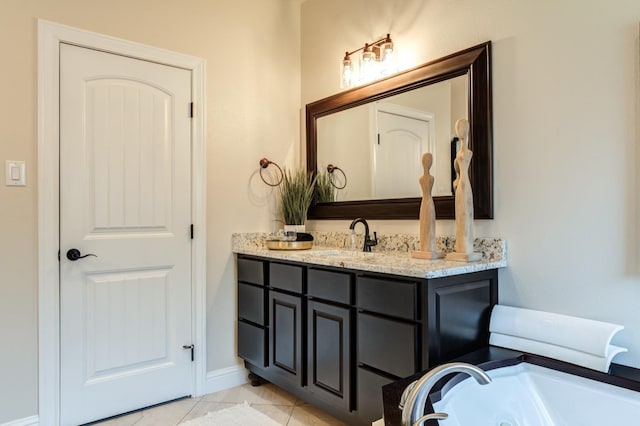 bathroom with vanity and a bathtub