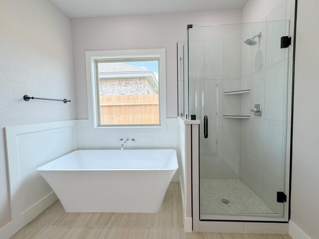 5811 Venita Ave, Lubbock, TX 79407 - full bathroom featuring a freestanding tub and a stall shower