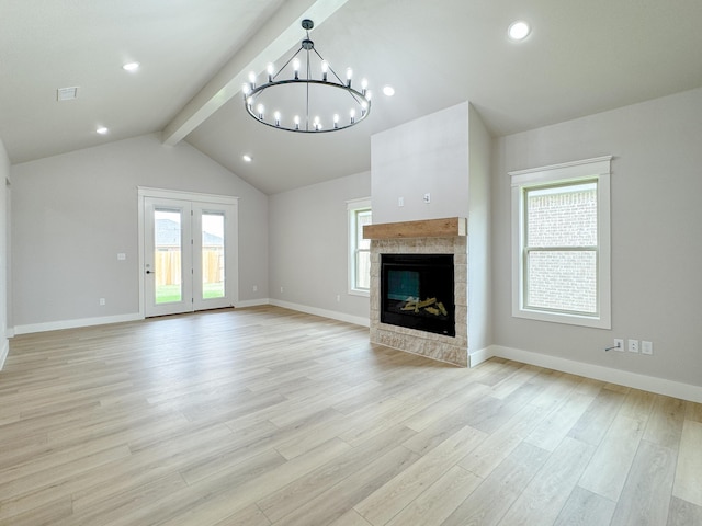 5811 Venita Ave, Lubbock, TX 79407 - unfurnished living room with a chandelier, light wood-type flooring, plenty of natural light, a tiled fireplace, and recessed lighting