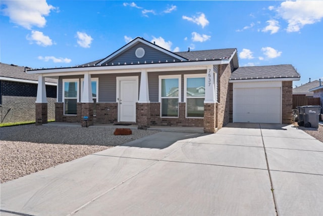 view of front of home with a garage and a porch