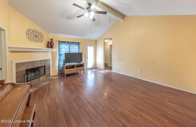 401 Oshkosh Ave, Lubbock, TX 79416 - unfurnished living room featuring a ceiling fan, wood finished floors, and a tile fireplace