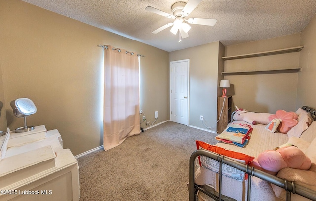 401 Oshkosh Ave, Lubbock, TX 79416 - bedroom featuring carpet, a textured ceiling, and a ceiling fan