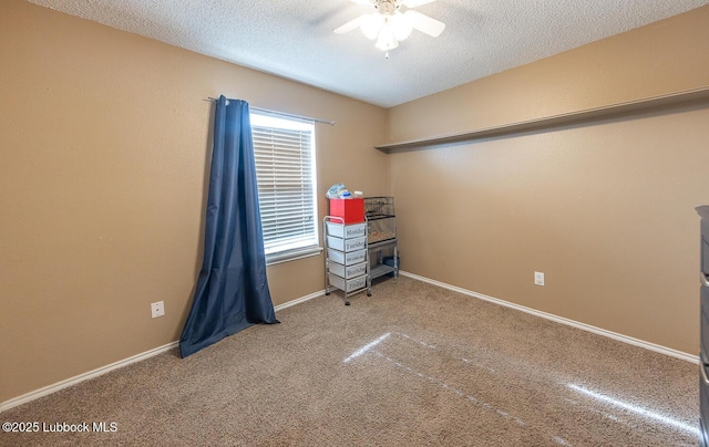 401 Oshkosh Ave, Lubbock, TX 79416 - spare room featuring a ceiling fan, carpet floors, and a textured ceiling