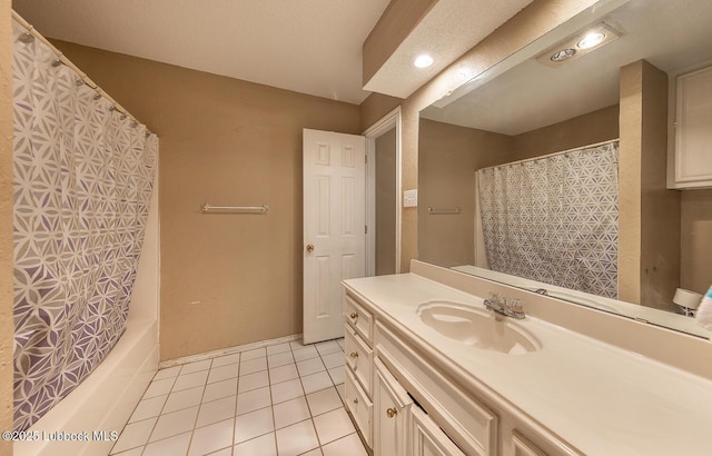 401 Oshkosh Ave, Lubbock, TX 79416 - full bathroom featuring tile patterned flooring, vanity, and shower / tub combo