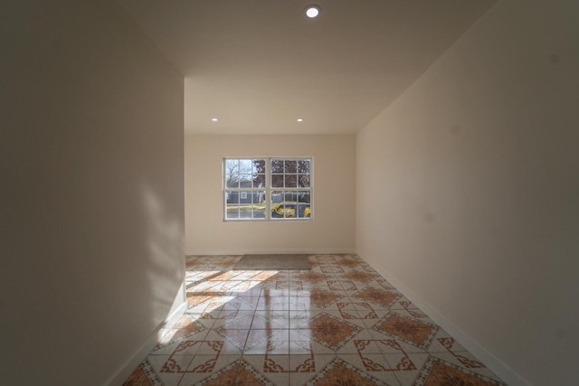 spare room with light tile patterned floors