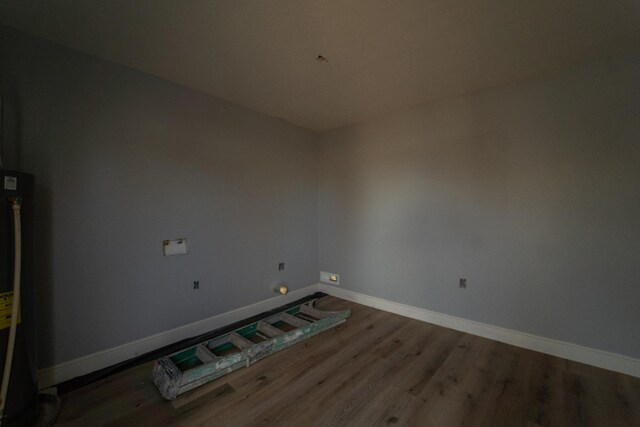 spare room featuring hardwood / wood-style flooring