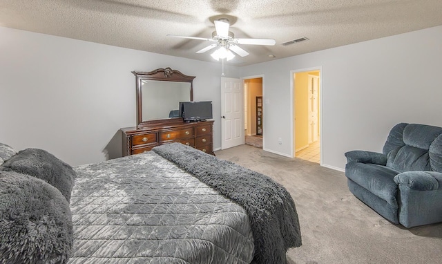 carpeted bedroom featuring baseboards, a ceiling fan, a textured ceiling, and visible vents
