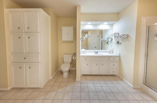 full bathroom with tile patterned flooring, vanity, toilet, baseboards, and a shower stall