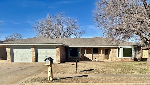 ranch-style house featuring driveway, brick siding, a shingled roof, an attached garage, and a front yard