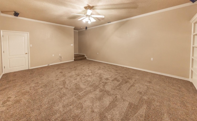 spare room with ceiling fan, crown molding, a textured ceiling, and carpet flooring