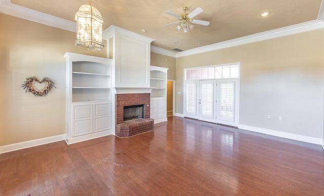 unfurnished living room featuring a fireplace, crown molding, dark wood-type flooring, and ceiling fan