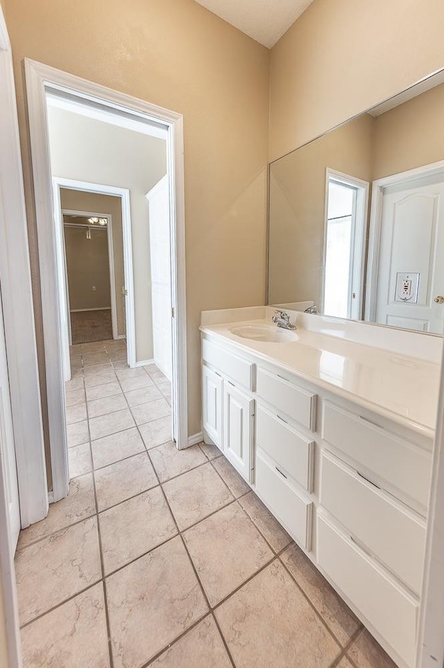 bathroom featuring tile patterned flooring and vanity