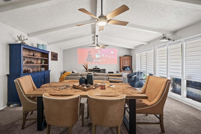 dining room with vaulted ceiling with beams, ceiling fan, a textured ceiling, and carpet