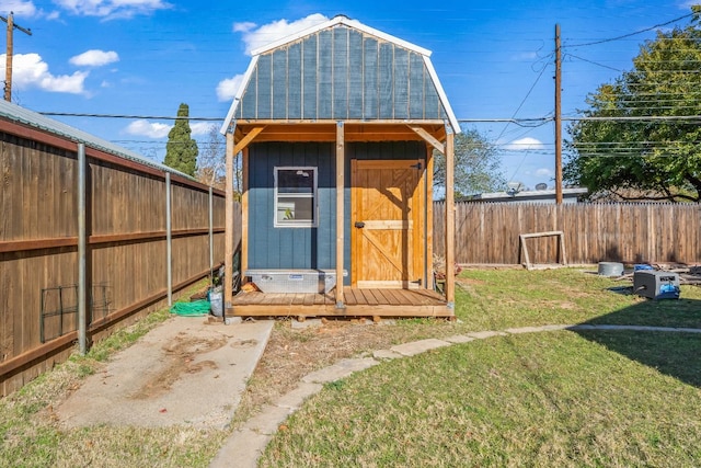 view of outdoor structure featuring a lawn